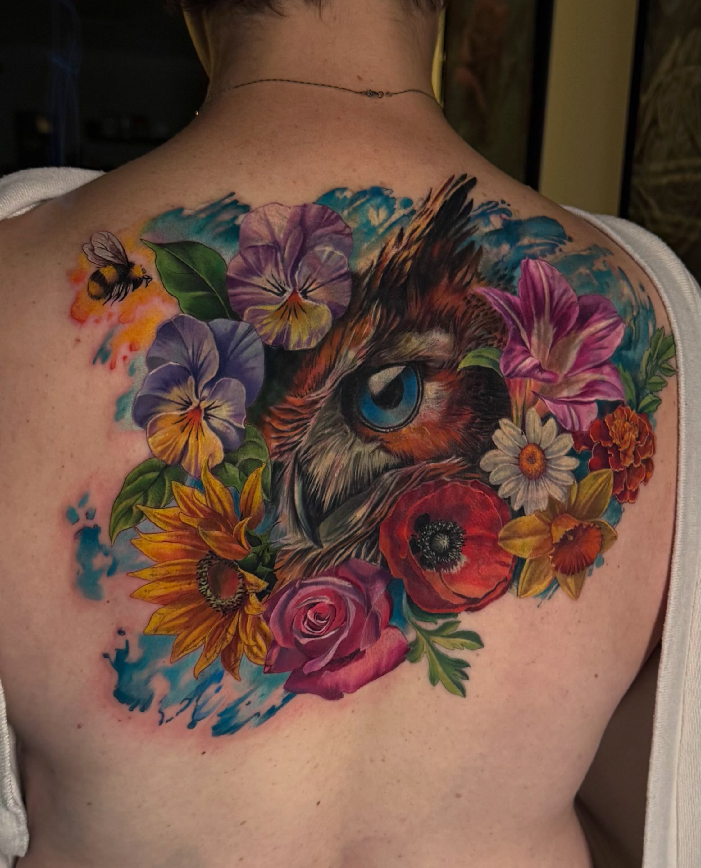 Colour realism owl and wildflowers cover-up tattoo by Julia Luniko in Winnipeg